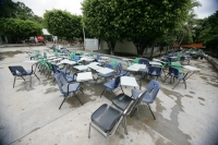Viernes 20 de agosto. Elementos del ejército mexicano prestan ayuda a las autoridades de educación para la limpieza de varios planteles educativos afectados en sus instalaciones y vehículos por las lluvias de esta semana en la ciudad de Tuxtla Gutiérrez, 