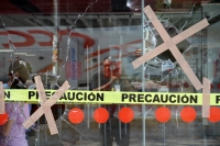 Viernes 15 de marzo del 2019. Tuxtla Gutiérrez. Negocios con destrozos y autos vandalizados después del operativo de desalojo del predio invadido en el libramiento norte