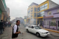 Mayo del 2015. Tuxtla Gutiérrez. Durante la jornada de incendios de edificios de partidos políticos del Movimiento Magisterial.