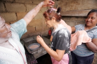 La ceremonia del Baño del Zapoyol, es realizada durante el cierre del Carnaval de la ciudad de Coita donde los participantes mojan su cabeza en agua preparada con cal y perfumes para luego colocar confetti en la cabeza, se bebe aguardiente antes y después